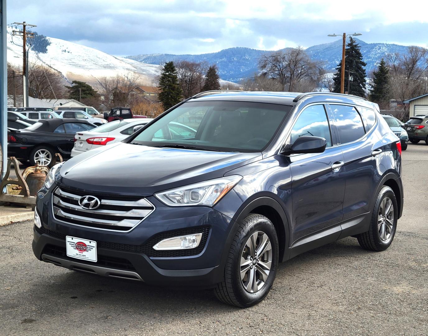 2016 Blue /Tan Hyundai Santa Fe Sport (5XYZUDLB6GG) with an 2.4L I4 engine, 6 Speed Automatic transmission, located at 450 N Russell, Missoula, MT, 59801, (406) 543-6600, 46.874496, -114.017433 - One Owner. Clean Carfax. Heated Seats. Towing. Air. Cruise. Tilt. Backup Camera. Power Windows and Locks. AM FM Bluetooth. - Photo#1